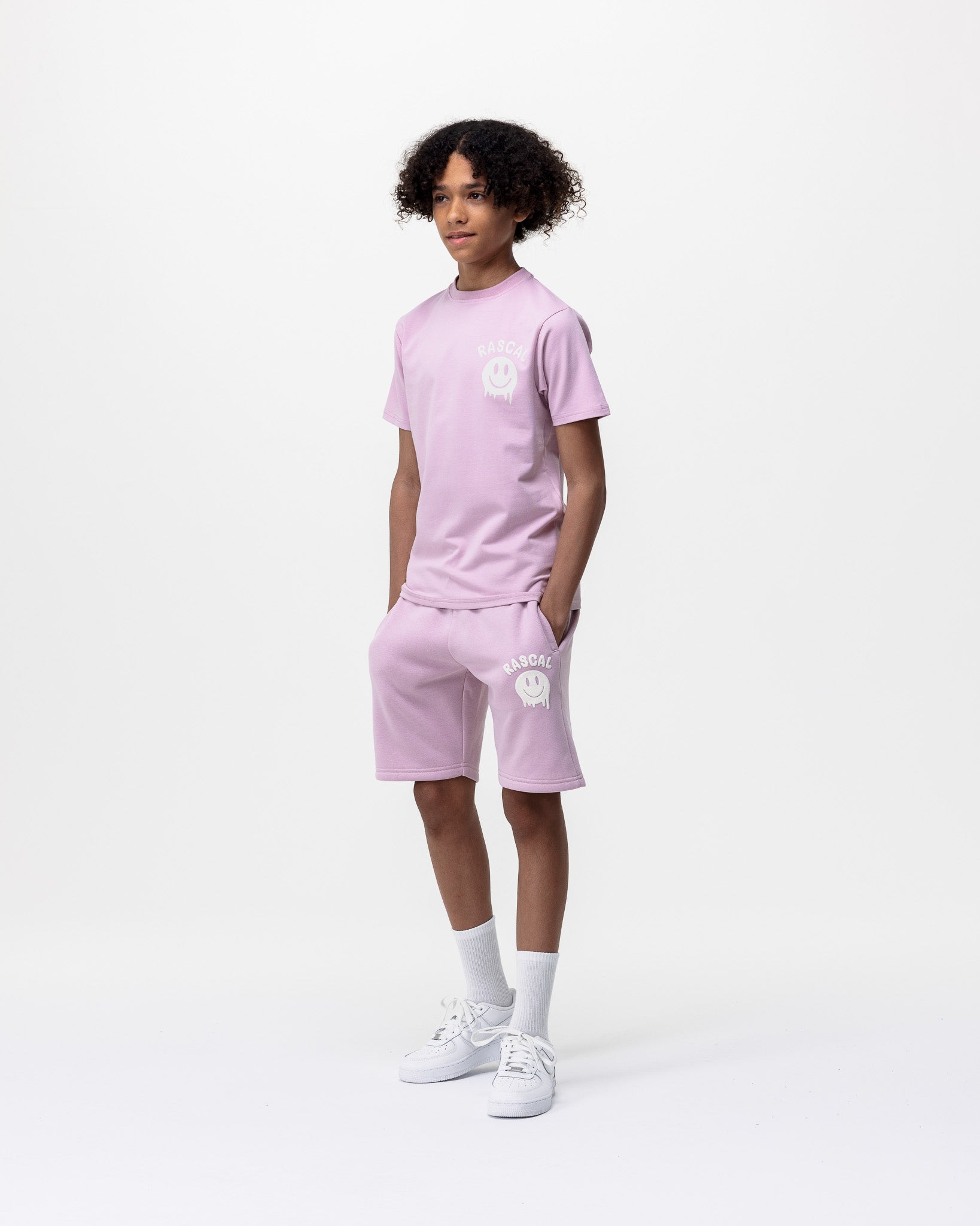 boy wearing Rascal pink smiley tshirt and pink jogger smiley face shorts