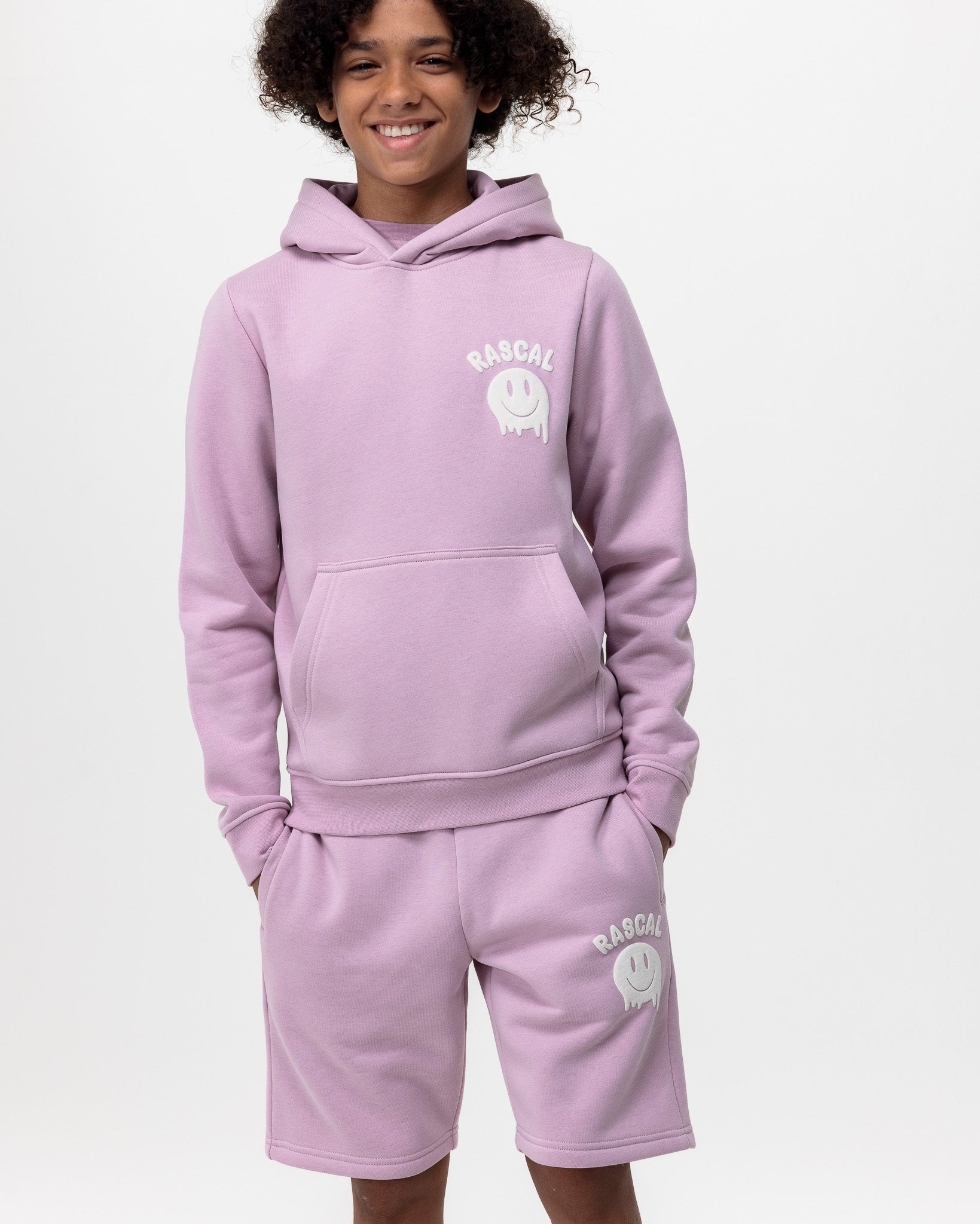 boy wearing pink smiley hoodie and pink smiley face shorts